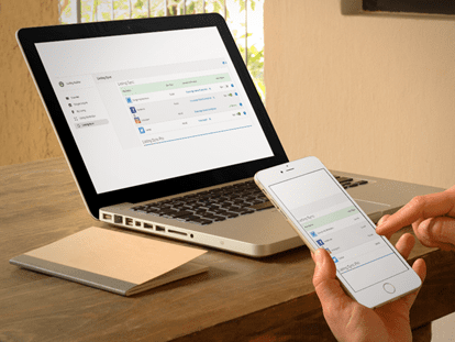 Person using the listing builder tool on laptop and phone Person using the listing builder tool on laptop and phone